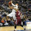 Dwayne Lathan is fouled driving for the rim.