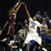 Steve McWhorter defends a secdond half Saluki three pointer.