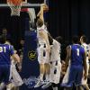 Jake Kitchell blocks Doug McDermott's layup.