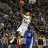 Dwayne Lathan scores on Creighton's Jahenns Manigat.