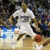 Steve McWhorter runs the offense as Creighton's Josh Jones defends.