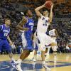 Jake Odum puts up a jumper over Josh Jones.