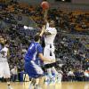 Carl Richard scores on Creighton's MVC Player of the Year Doug McDermott.