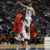 Justin Gant blocks a Cardinal shot; one of his five blocks for the game.