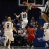 Dwayne Lathan slam dunks.