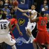 Jake Odum whips a pass from the baseline out to an open Carl Richard.