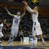 Jake Odum and Jordan Printy leap for a rebound.