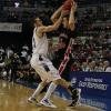 Jake Odum defending and going for the ball.