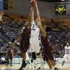 Justin Gant stretches for a two handed rebound.