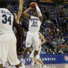 Dwayne Lathan gets off a jumper in the lane.