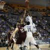 Myles Walker elevates for a left handed jump hook in the paint.