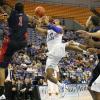 Dwayne Lathan drives and is fouled by Mike McFadden.