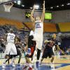 RJ Mahurin is held down as he jumps for a rebound.