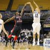 Jordan Printy shoots over Velton Jones' defense.