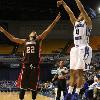 Brenton launches a baseline three pointer.