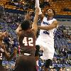 Devonte lifts a soft shot to the rim.