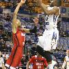 Tre lays the ball over the front of the rim.