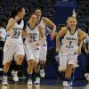 Anna Munn, Jessica Valley, Shannon Thomas, Taylor Whitley, and Brittany Schoen leave the court after the final buzzer.