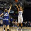 Deja Mattox fires over Taylor Johnson's defense.