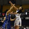 Anna Munn puts up a jumper as the home crowd screans for a foul call.