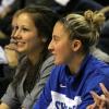 A sidelined Jessica Valley watches from the bench with Nikki Gunning.