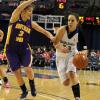 Anna Munn works the ball upcourt against strong defense.