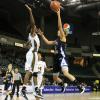 Deja Mattox drives on Lady Shocker Jazimen Gordon.