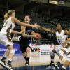 Natasha Zurek drives and Jazimen Jones reaches out to strip the ball away.