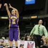 UNI's Brittini Donaldson fires a three point jumper.
Creighton's lime green sherbert clad Coach Flannery uses body english to alter the shot.