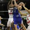 Carly Grenfell battles Lady Redbird Candace Sykes for a rebound.