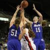 Rachael Hackbarth goes high for a rebound.