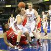 Karly Buer and Whitney Edie struggle to gather in a loose ball.  Bradley's Latasha Hollingshed watches from the floor.