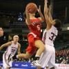 Lady Brave Hanna Muegge drives and shoots over MSU's Christiana Shorter.