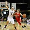 Casey Garrison guards a driving Lauren Niemiera.