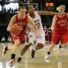 Catie O'Leary gets a shoulder past her defender, Jaleshia Roberson.