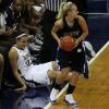 Brittany Schoen is fouled along the sideline in front of the Notre Dame bench.