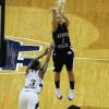 Brittany Schoen fires a long three pointer.