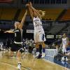 Lightning quick Brittany Schoen goes high for a three pointer.