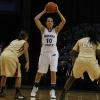 Jessica Valley holds the ball high as she looks to make a pass.