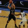 Sadie Oyer holds the ball high at the left elbow.