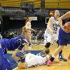 Natasha Zurek, Anna Munn, and Kasey Johnson fight for a loose rebound.