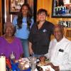 Cierra Ceazer and Coach Janet Eaton with two fans at the Rick's Smokehouse "Meet and Greet".